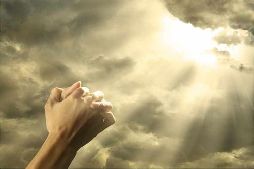 hand folded in prayer